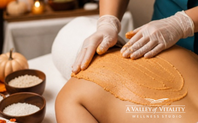 Esthetician applying an exfoliating treatment during a back facial at a Prescott AZ wellness studio